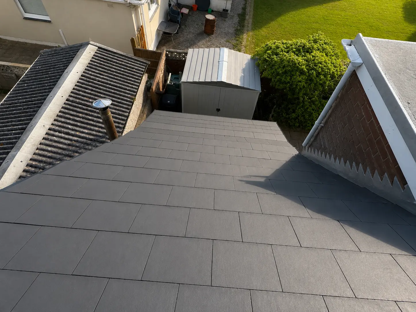 Newly slated garage roof viewed from above
